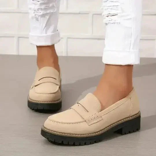 "Comfortable women's slip-on suede sandals showcasing soft suede texture and supportive sole for stylish all-day wear."