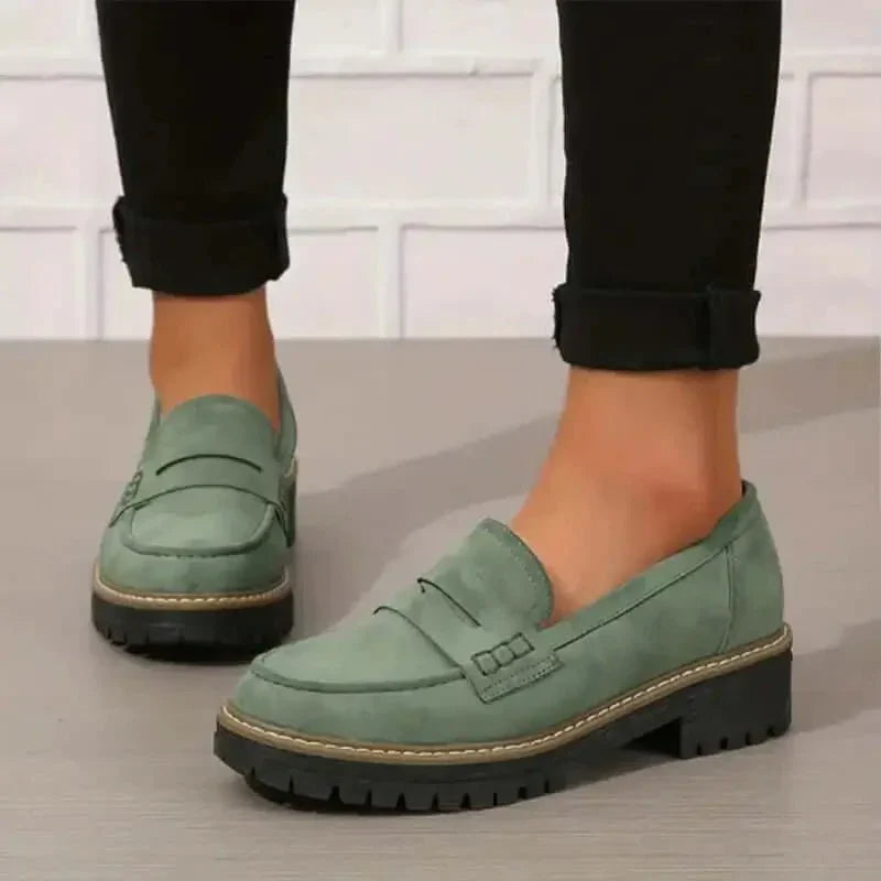 "Comfortable women's slip-on suede sandals showcasing soft suede texture and supportive sole for stylish all-day wear."