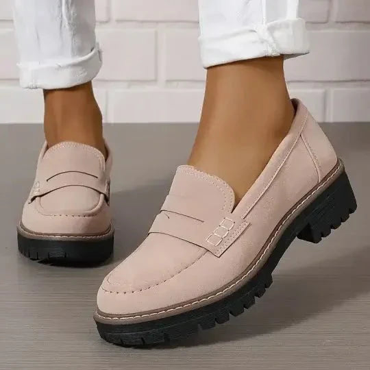 "Comfortable women's slip-on suede sandals showcasing soft suede texture and supportive sole for stylish all-day wear."