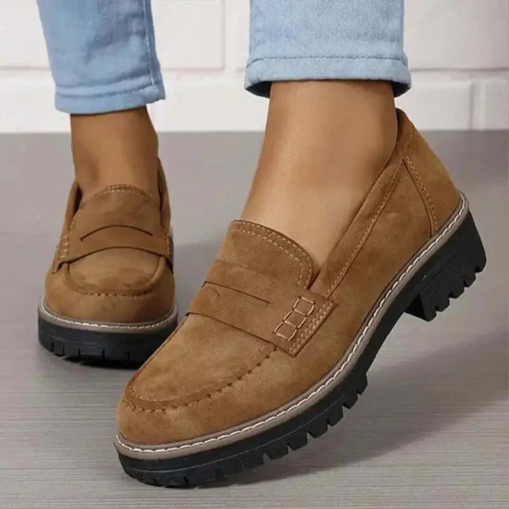 "Comfortable women's slip-on suede sandals showcasing soft suede texture and supportive sole for stylish all-day wear."