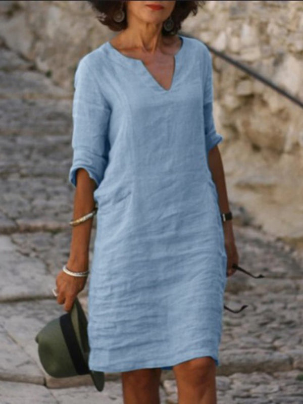 Elegant slim fit V-neck cotton linen dress with mid sleeves, perfect for warm weather. Shop women's dresses for all occasions