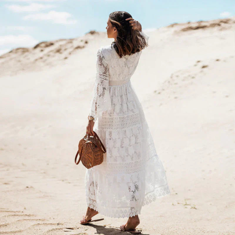 "Elegant women's long-sleeved boho dress with artistic flair, featuring bohemian pattern and flowing silhouette."
