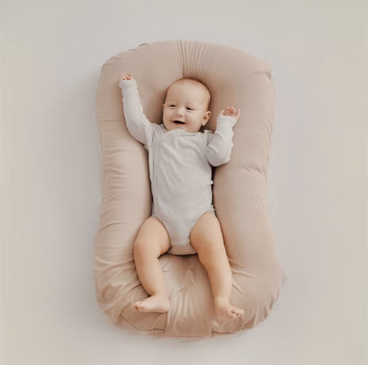 Ergonomic Breathable Baby Pillow in pink, green, and brown; hypoallergenic, provides head support, prevents flat head.