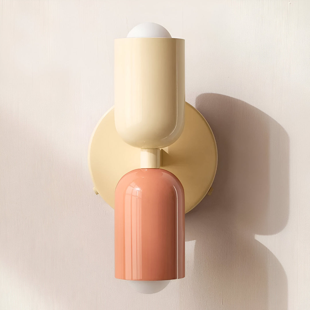 Nordic colourful double head wall light in vibrant colors, painted iron, sleek cylindrical design, casts light up and down.