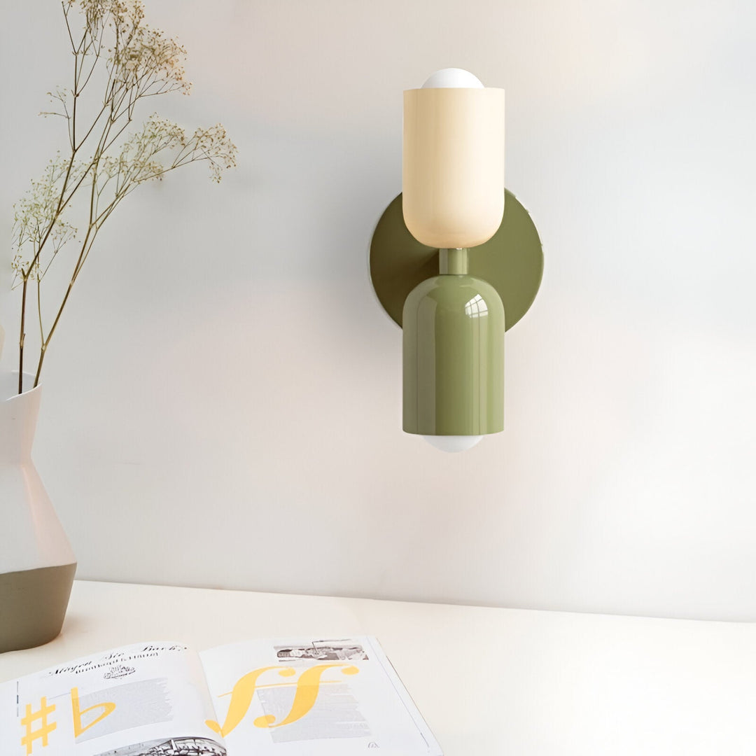Nordic colourful double head wall light in vibrant colors, painted iron, sleek cylindrical design, casts light up and down.