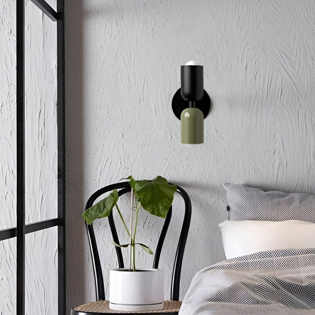 Nordic colourful double head wall light in vibrant colors, painted iron, sleek cylindrical design, casts light up and down.