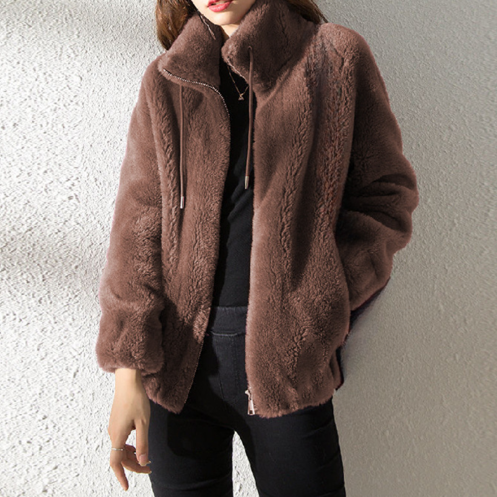 "Stylish women's warm jacket, grey, zip closure, premium polyester, elegant design, versatile fit for the chilly season."