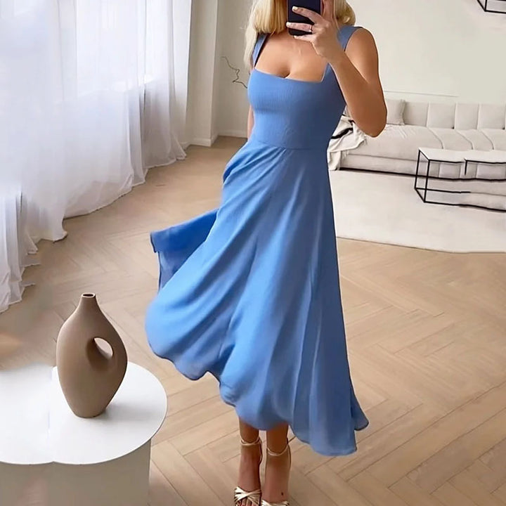 "Woman in elegant black sleeveless square neck A-line midi dress"