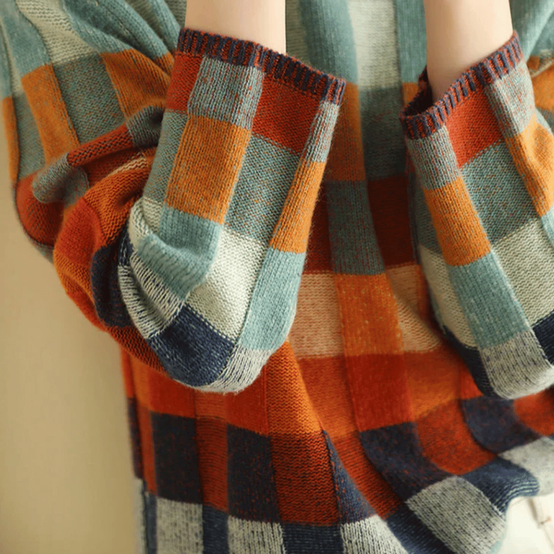 Women's cashmere patchwork turtleneck sweater in mélange hues, showcasing a unique, cozy, and stylish design for winter.