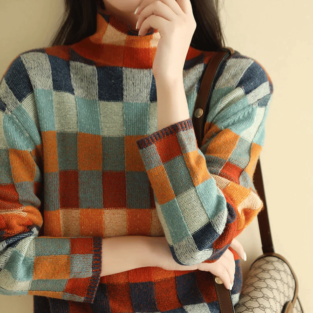 Women's cashmere patchwork turtleneck sweater in mélange hues, showcasing a unique, cozy, and stylish design for winter.