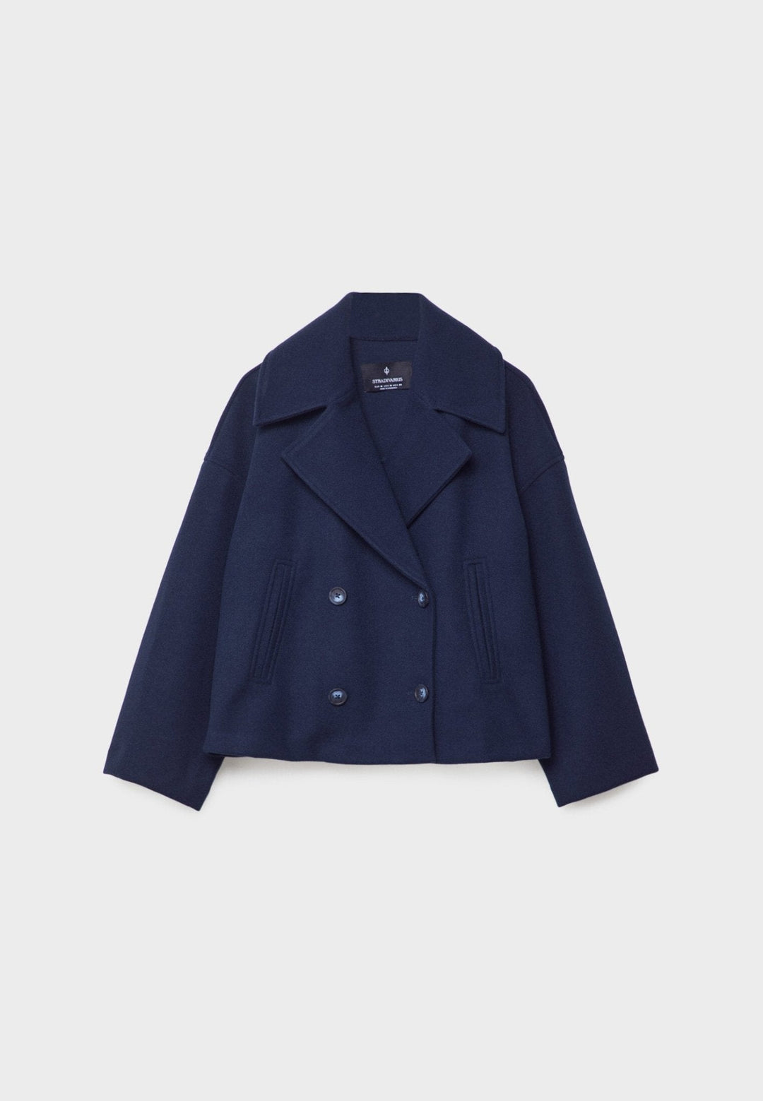 Women's double-breasted cropped jacket, front view featuring sharp lapels, structured design, and chic oversized buttons.