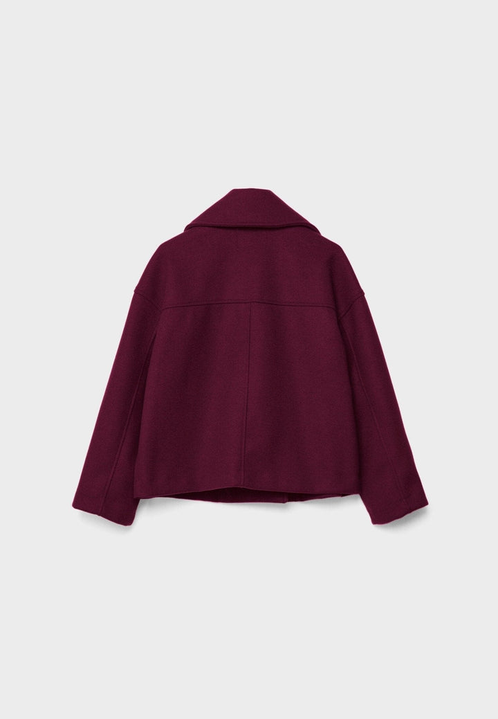 Women's double-breasted cropped jacket, front view featuring sharp lapels, structured design, and chic oversized buttons.