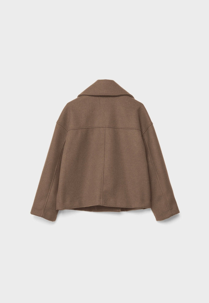 Women's double-breasted cropped jacket, front view featuring sharp lapels, structured design, and chic oversized buttons.