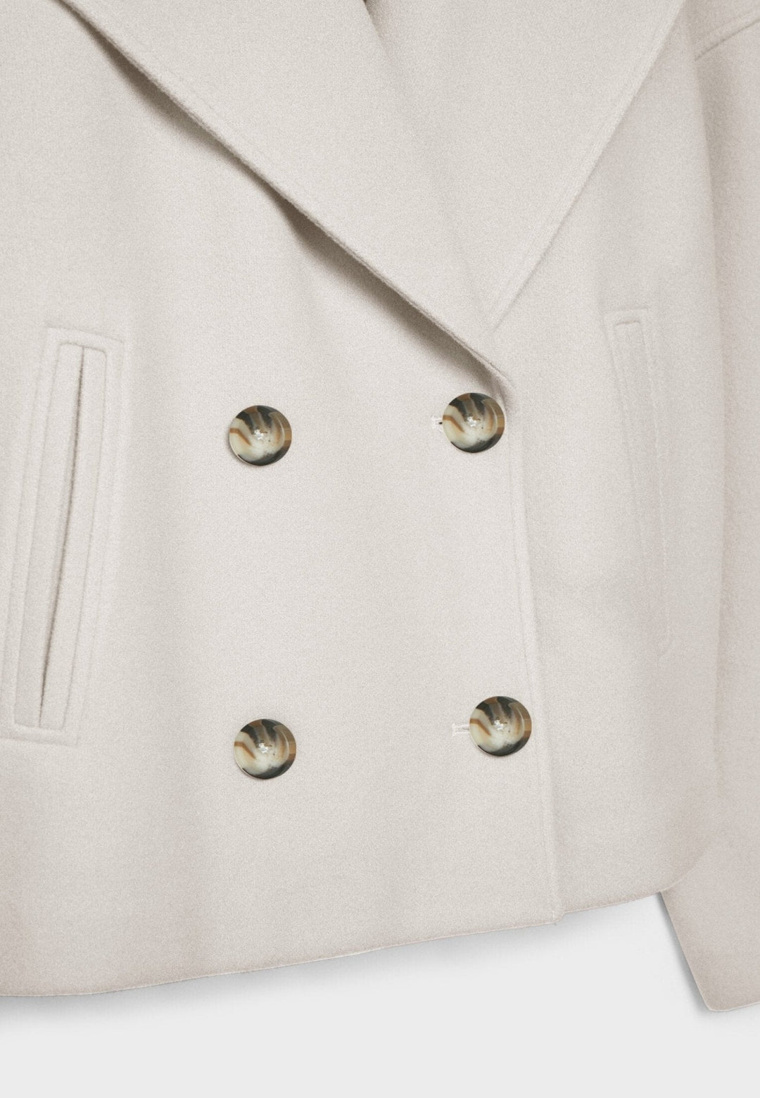 Women's double-breasted cropped jacket, front view featuring sharp lapels, structured design, and chic oversized buttons.