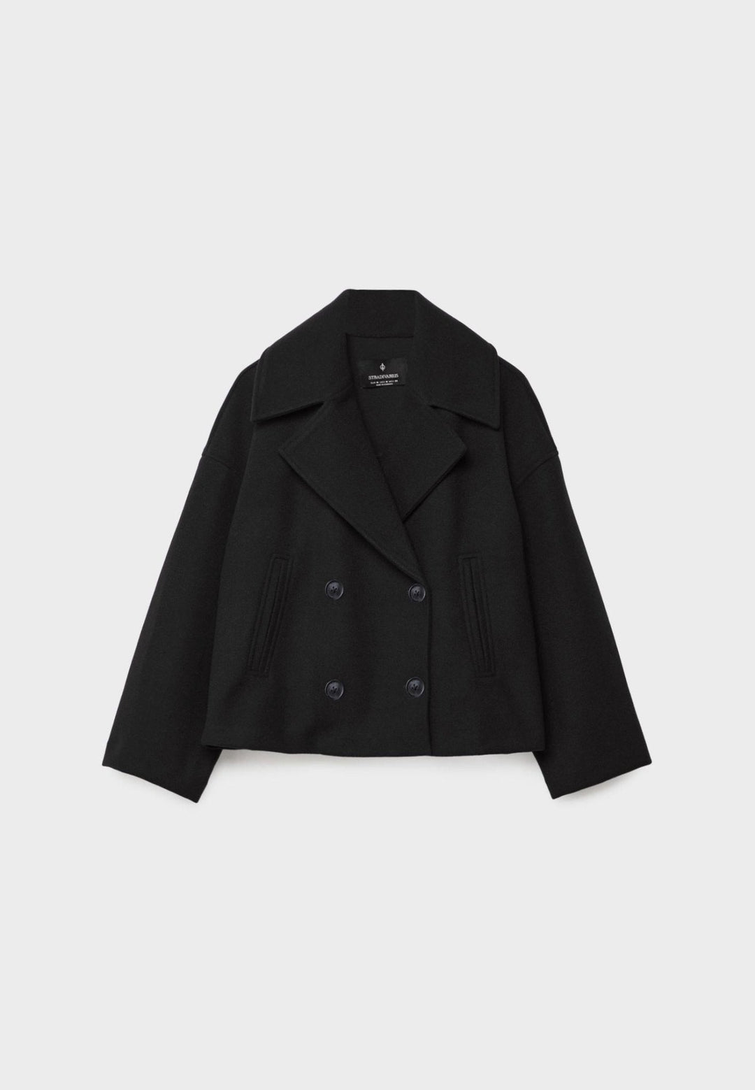 Women's double-breasted cropped jacket, front view featuring sharp lapels, structured design, and chic oversized buttons.