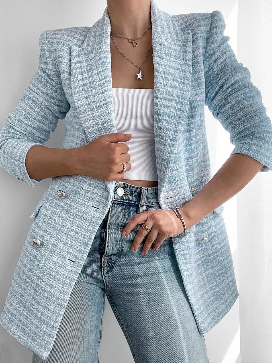 Women's fashionable light blue tweed blazer, front view. Tailored fit, elegant design, classic silhouette for versatile wear.