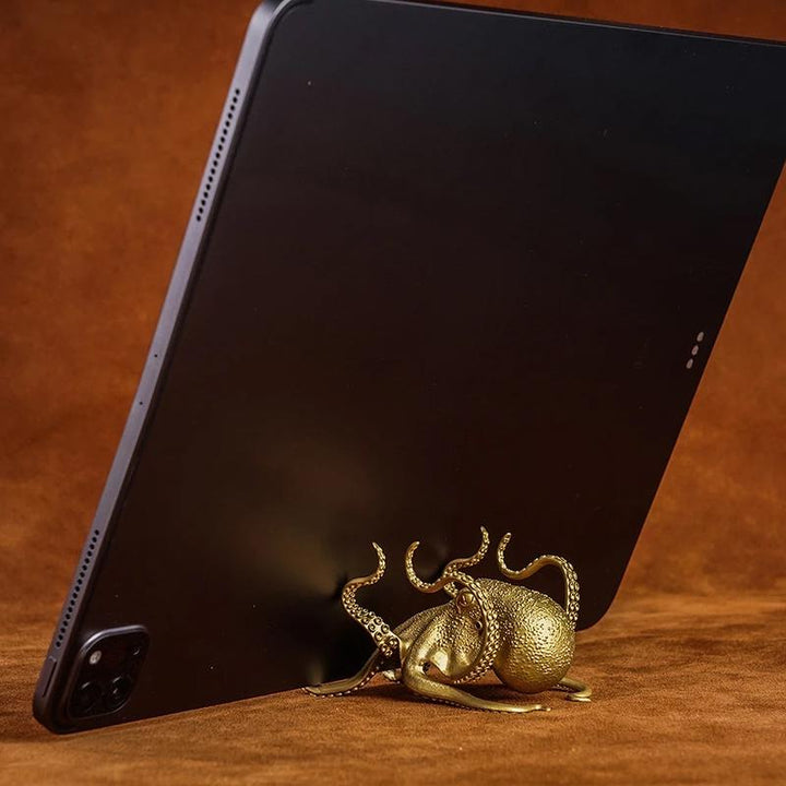 Elegant brass octopus figure, doubles as a phone stand and novelty desktop decor