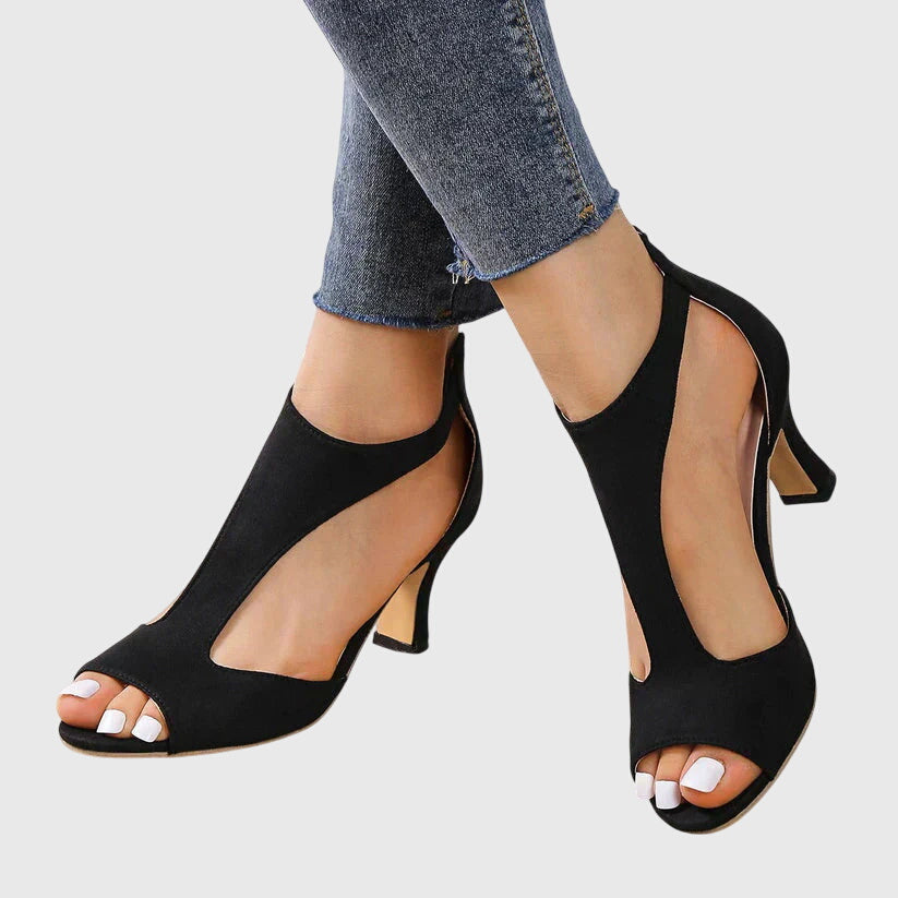Dressy women's sandals featuring a trendy cut-out, peep toe, and stable block heel design.
