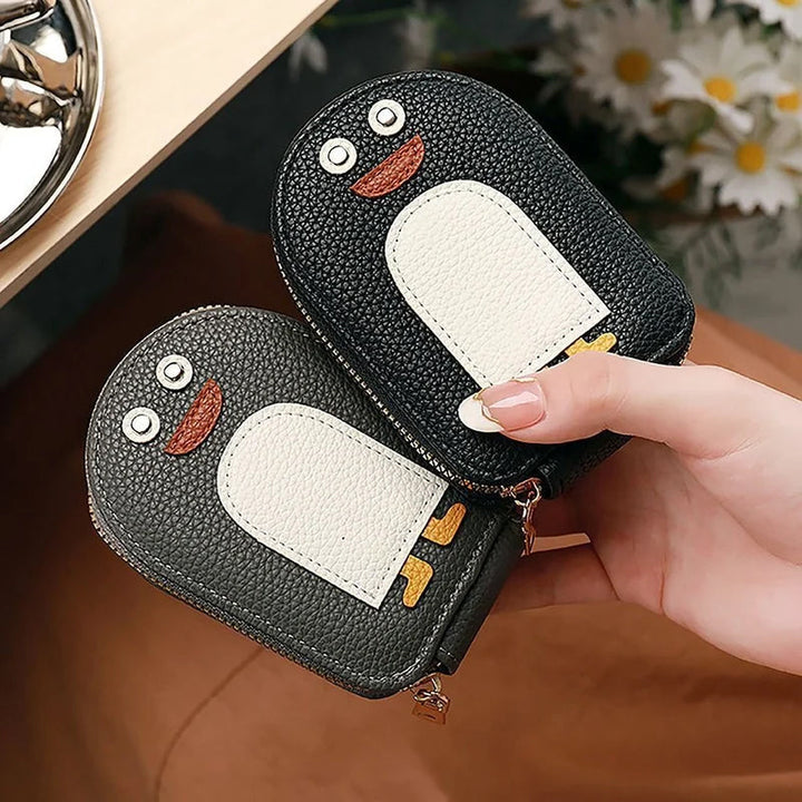 Cute penguin PU leather card & coin wallet for women, compact and stylish accessory.