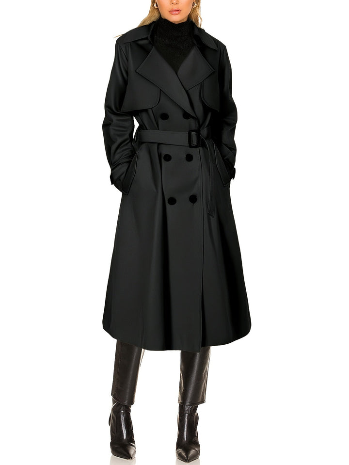Professional women's outerwear: a longline double-breasted trench coat, ideal for business and style.