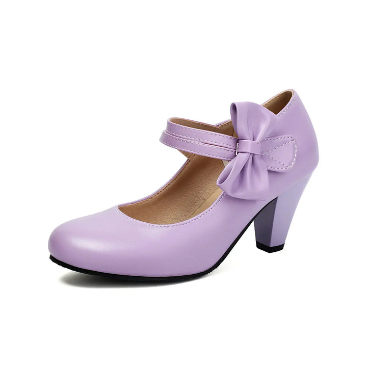 Stylish purple block heel pumps for women, featuring an elegant bow, suitable for party wear.