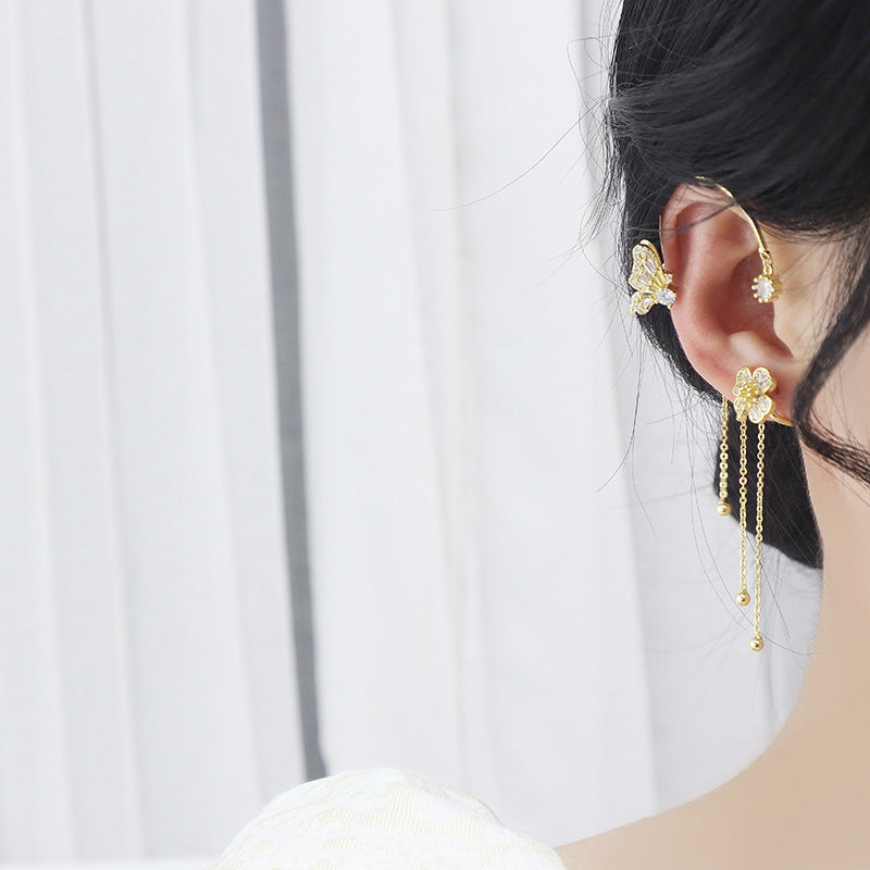 Delicate women's fashion earrings: a butterfly silhouette adorned with zircon and long dangle.