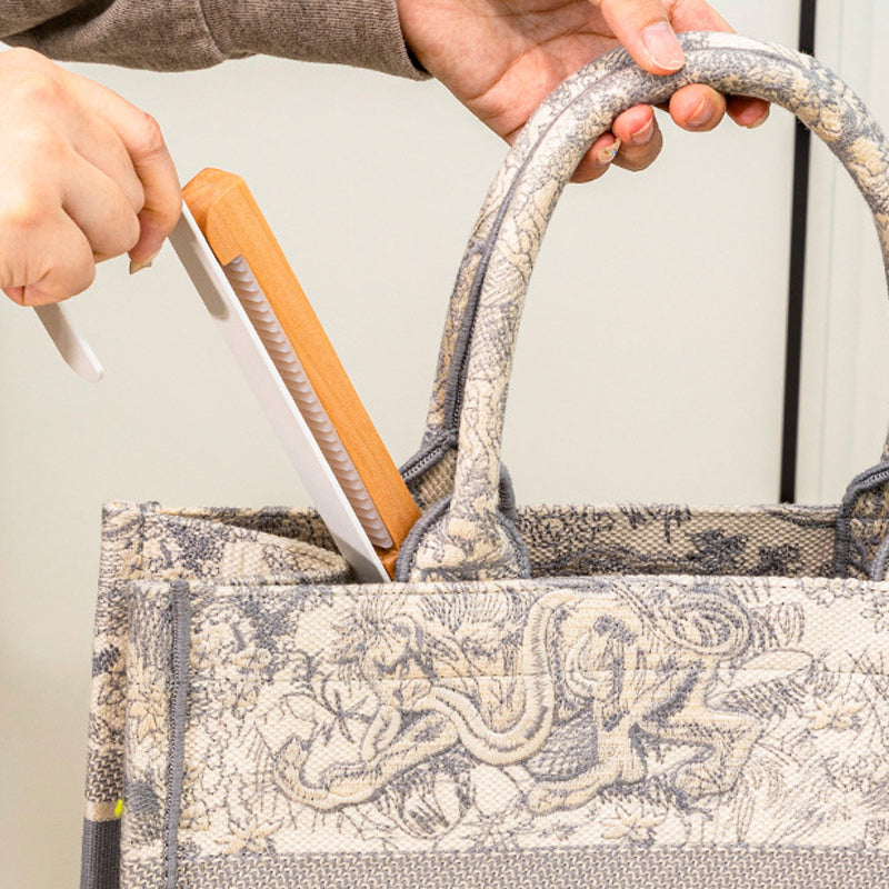 Travel-friendly foldable over-the-door wood and metal hook, compact and space-saving.