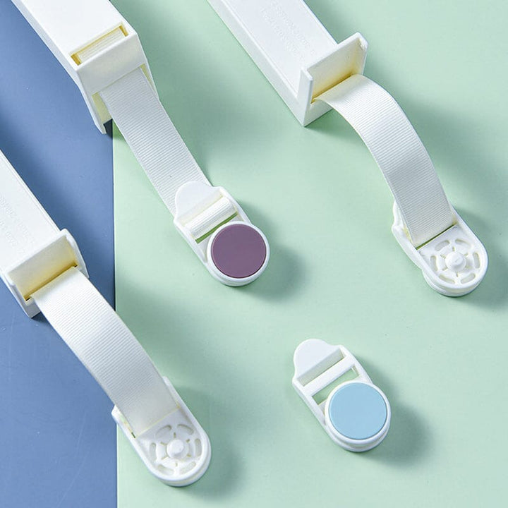 Close-up of a single bed sheet gripper clip, showing its unique secure design