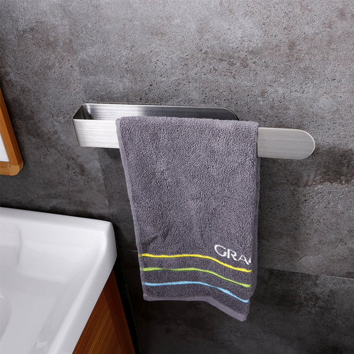 Gold stainless steel towel rack, adhesive, keeps towels neat in kitchens & baths.