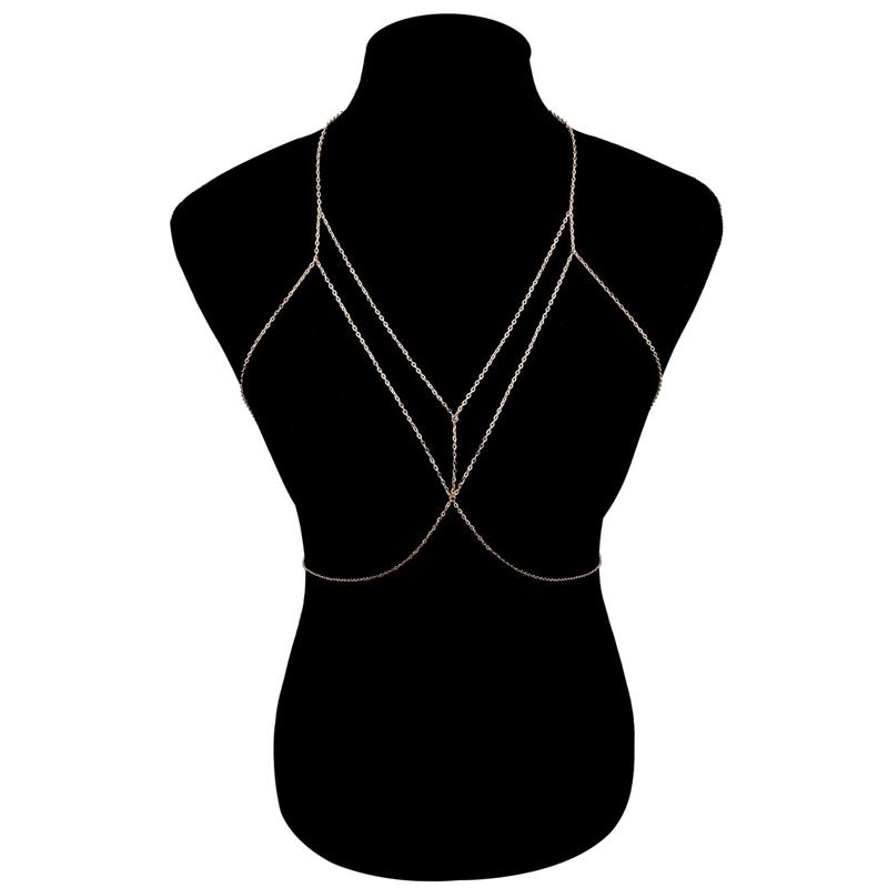 Close-up of a shimmering silver layered body chain, elegant & stylish