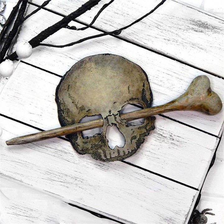 Stylish metal hair pin, gothic-inspired skull and moth, faux bone detailing, perfect for a women's vintage look.