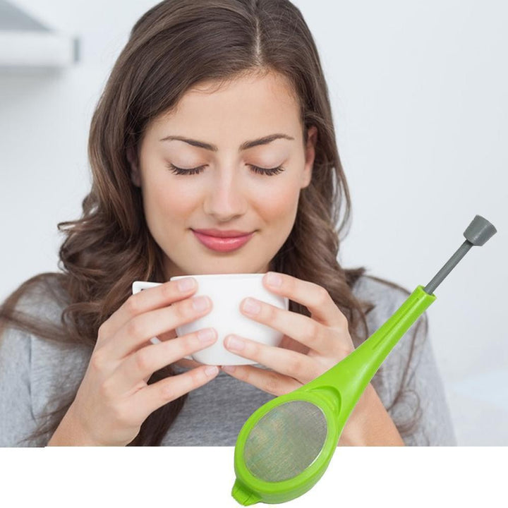 Green tea infuser spoon, sleek design, for loose leaf tea; convenient & durable tea brewer.
