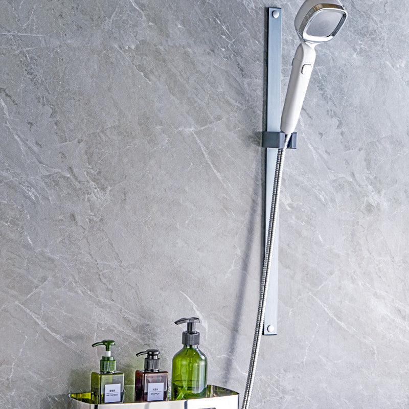 Bathroom accessory: a versatile handheld shower head with a pause switch, great for washing pets.