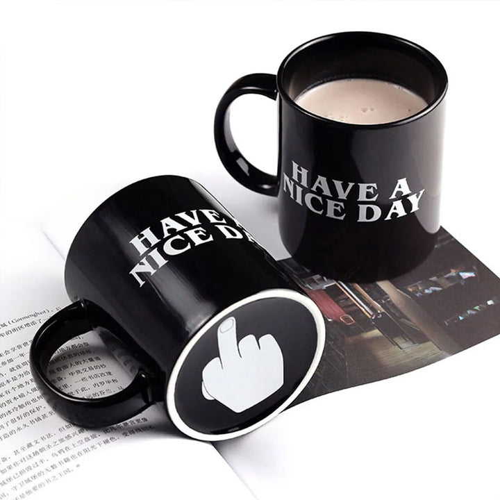 Ceramic coffee mug with an orange interior, a humorous gag gift