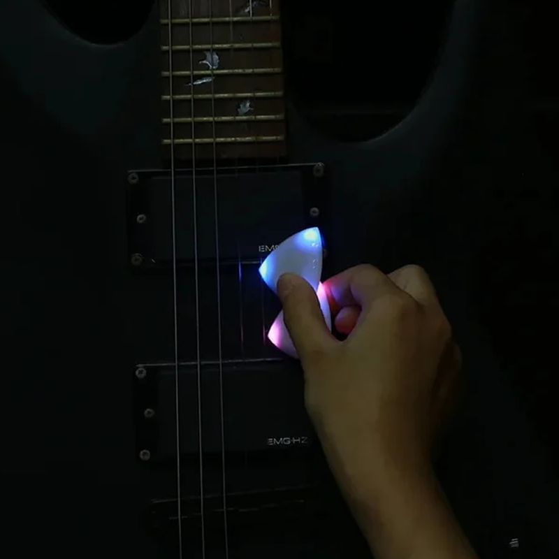 Ergonomic Light Up Guitar Pick designed for comfortable grip and enhanced stage presence for musicians.