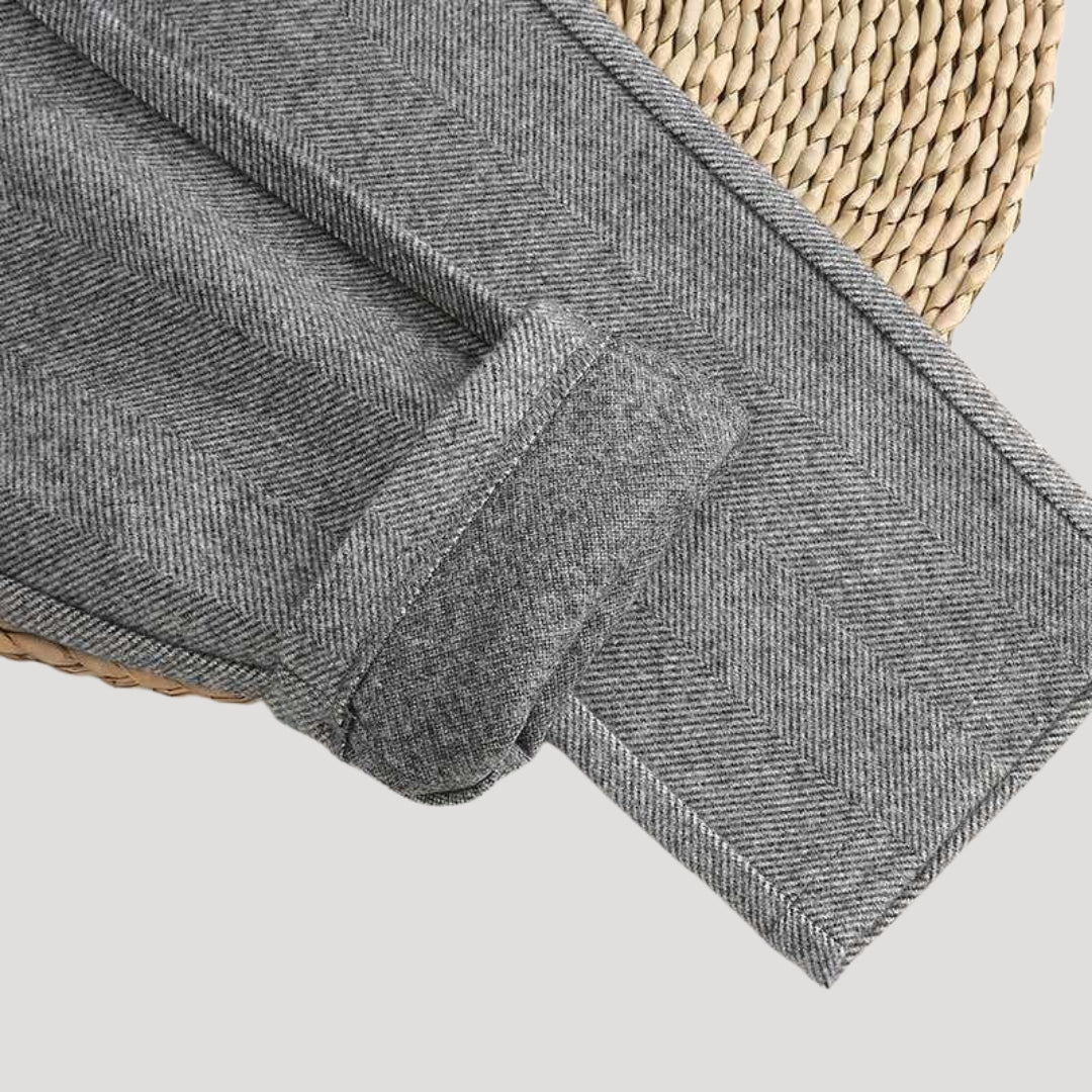 Detail of the hem and ankle length of men's tailored pants, emphasizing the modern fit and design.