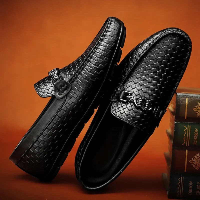 Close-up of the sole of black men's grip loafers, showing traction for comfortable wear