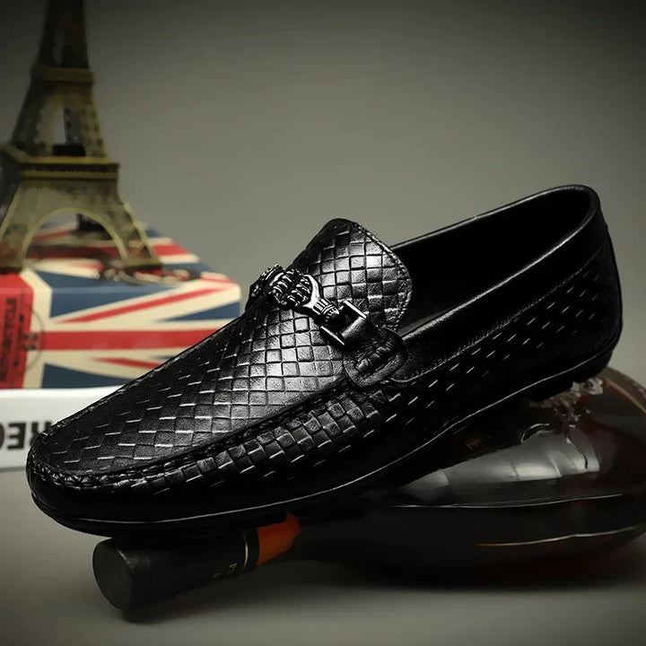 Top view of men's black grip loafers, highlighting the slip-on comfort and leather texture