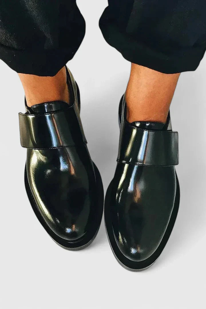 Men's black leather slip-on loafers, ideal for spring and summer casual or formal comfort.