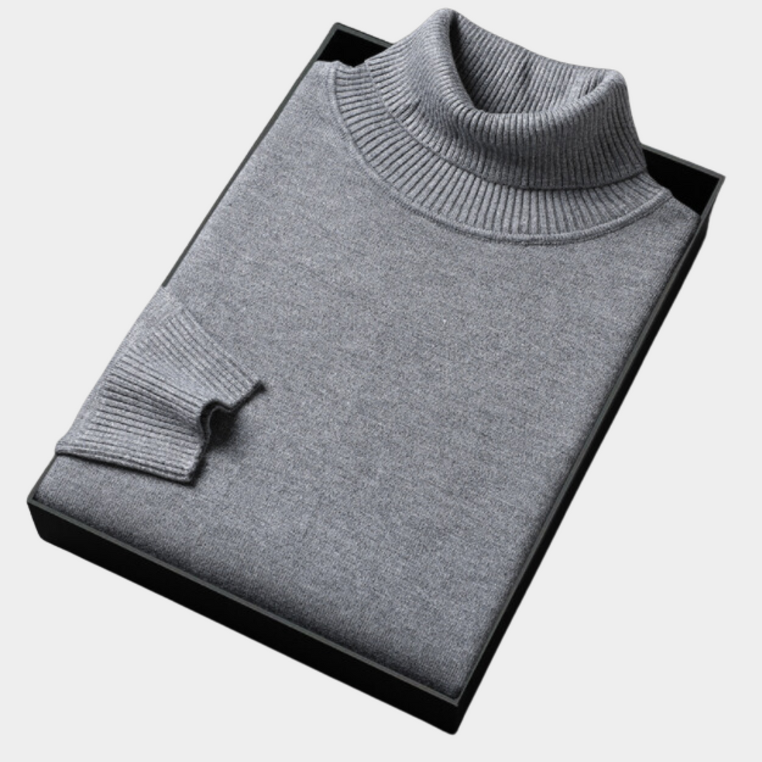Front view of a men's bold orange turtleneck sweater, highlighting its vibrant color and knit design.