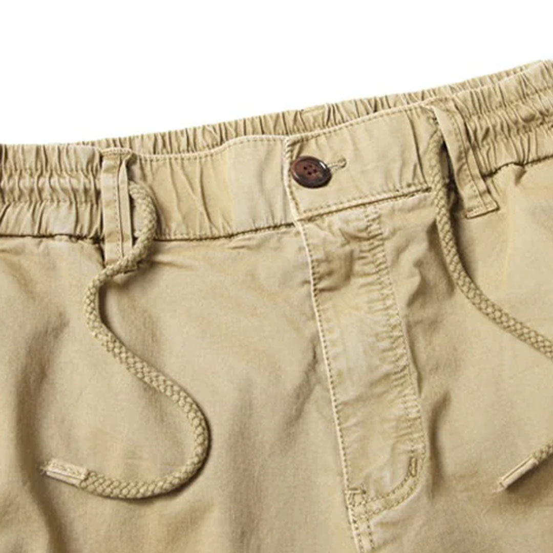 Close-up of the elastic waistband and drawstring on men's casual jogger pants for a secure fit.
