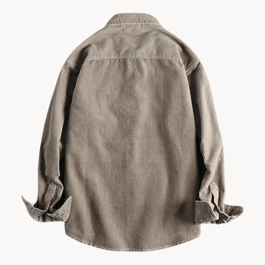 Close-up of the textured corduroy fabric on a men's long sleeve collared shirt, ideal for winter