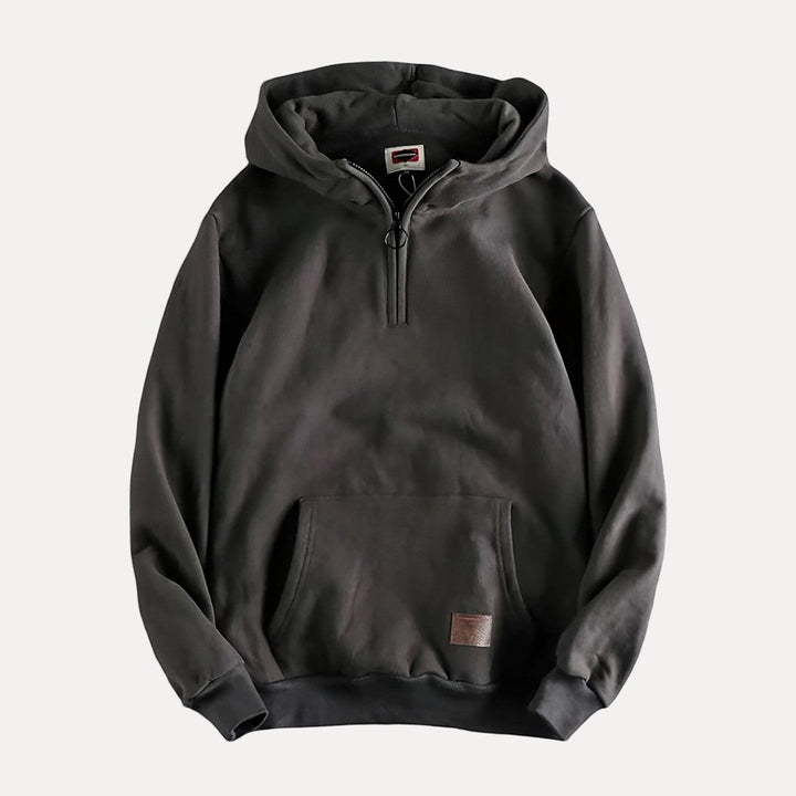 Dynamic shot of a men's long sleeve pullover hoodie, highlighting its casual comfort and modern design.