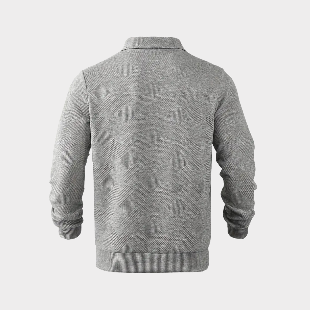 Close-up of the textured design on a men's half-zip pullover, casual knit fabric detail