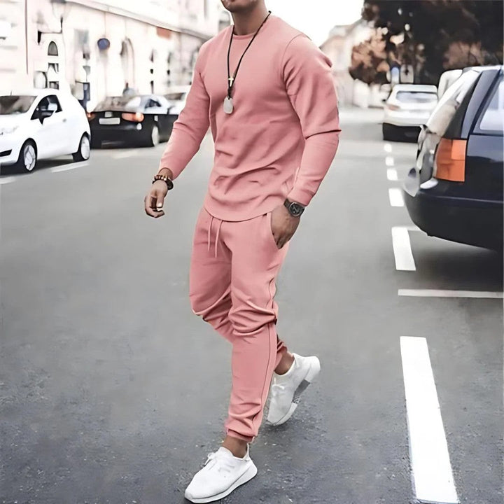 Stylish men's two-piece tracksuit set with a zip-up jacket and joggers, great for everyday fashion.