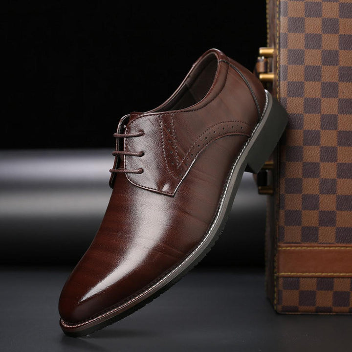 Men's classic black leather lace-up dress shoes, perfect for formal events and business attire.