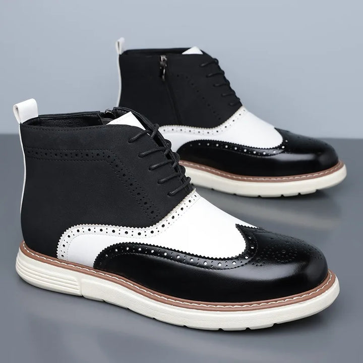 Detailed shot of the lacing and brogue pattern on men's classic leather boots.