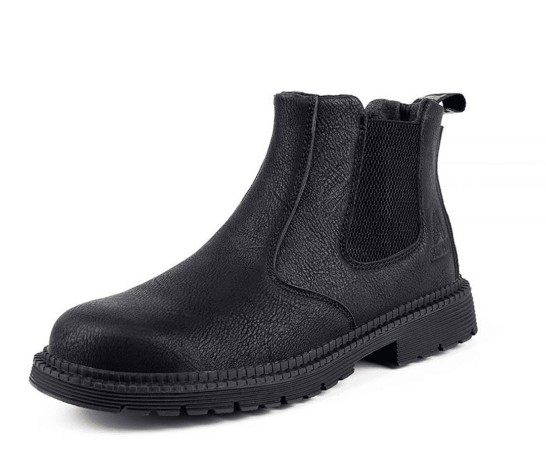 Close-up of men's brown leather Chelsea boot, showcasing elastic side panel and pull tab for easy slip-on