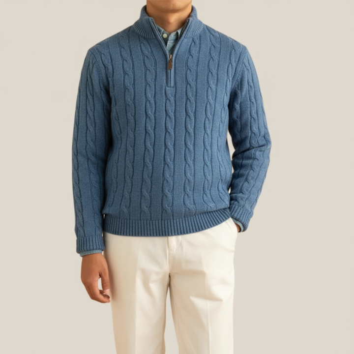 Close-up of the intricate cable knit pattern on a men's half zip pullover sweater, showcasing quality knitwear.