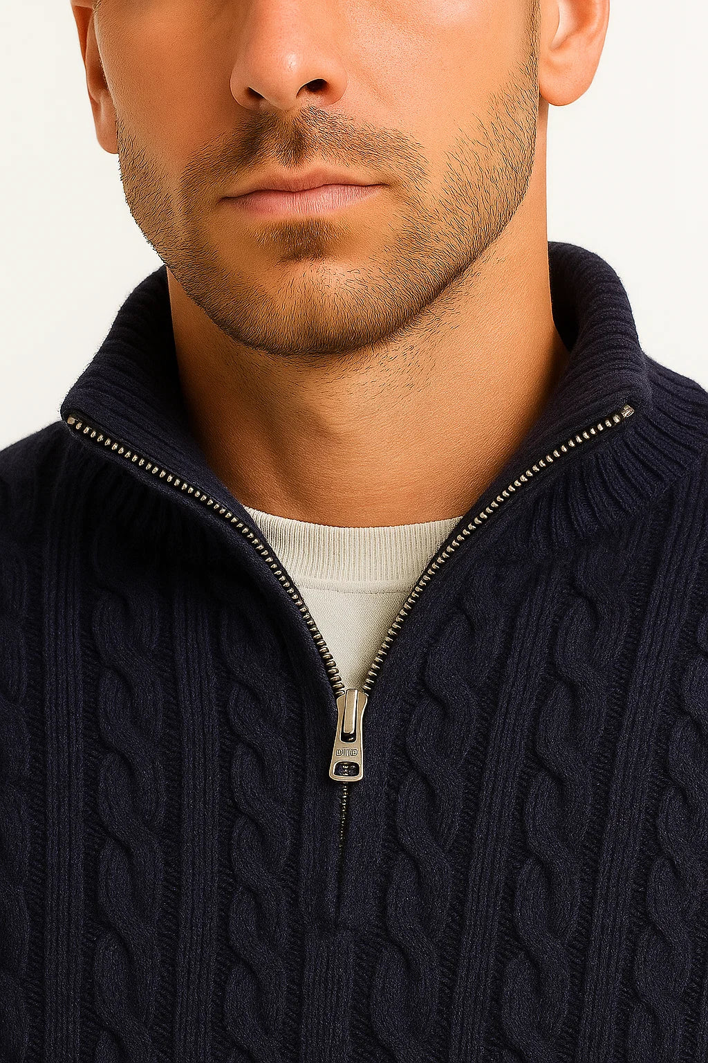 Stylish men's cable knit sweater with a zip neck in a warm tone, great for cool spring evenings.